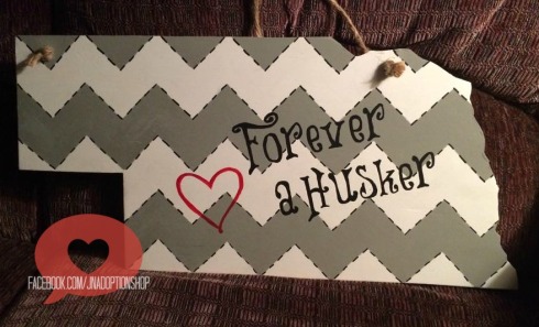 A touch more subtle in grey chevron, the message is still clear: Forever a Husker! 